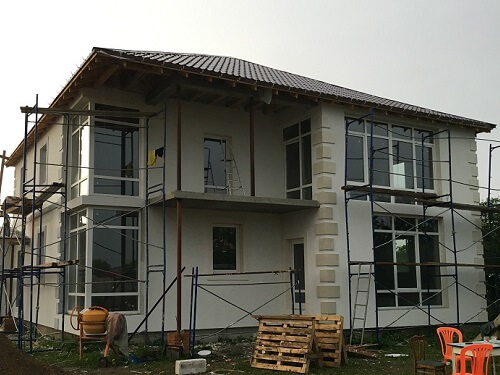 Отделка фасада дома штукатуркой в Минске